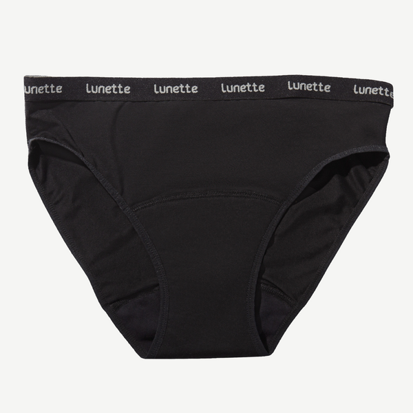A pair of black Lunette period panties with a wide waistband, made from organic cotton and other materials, designed for comfort and leak protection.