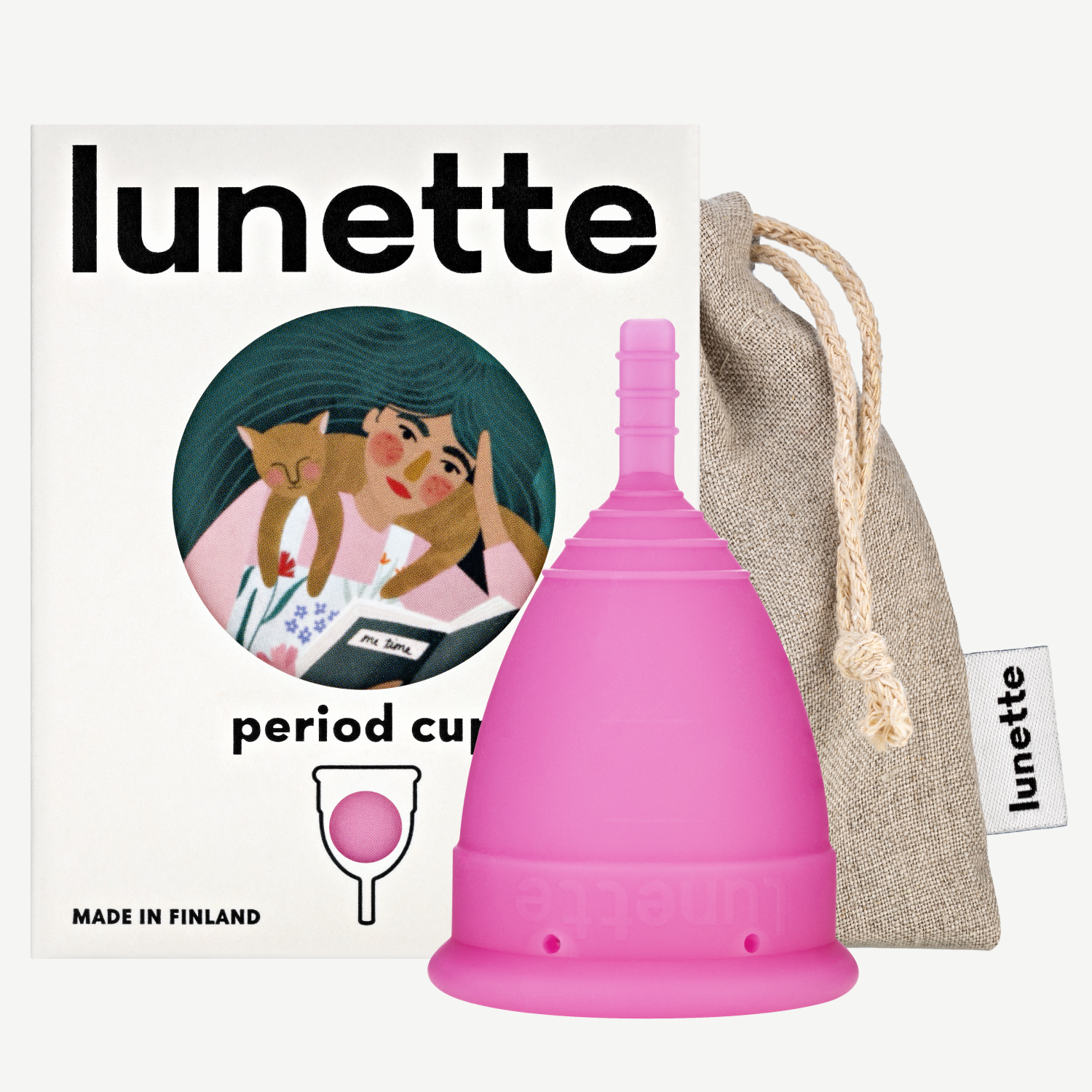 A pink Lunette period cup displayed alongside its packaging box with a floral design and a linen storage pouch. The box includes the text 'period cup', 'made in Finland', and the brand name 'Lunette'.