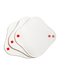 Three white reusable feminine pads with red buttons on the lower part, displayed on a white background.